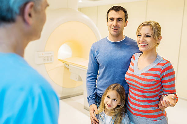 family in front of mri machine