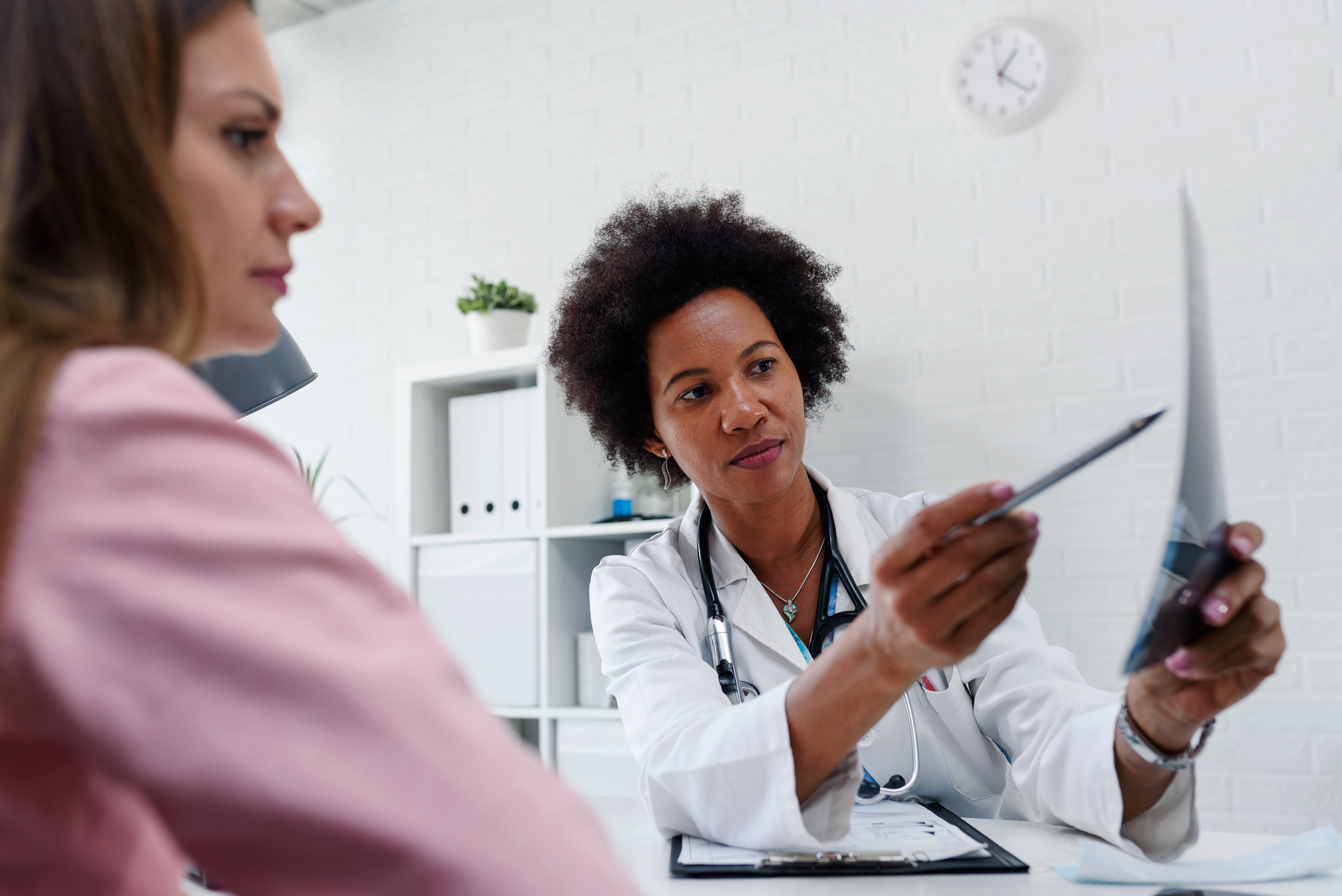 doctor talking with patient